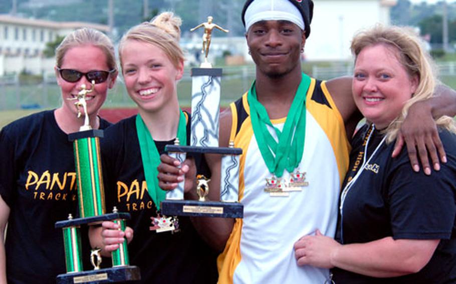 Kadena coach Beth Pulaski, senior captains Shelby Witschen and Shun Bowens and assistant coach Stephanie Davis show off the team championship hardware. The Kadena teams combined for seven gold medals; Kadena&#39;s boys outdistanced Christian Academy In Japan 88-76.6, while the Panthers girls edged Kubasaki 92-85.