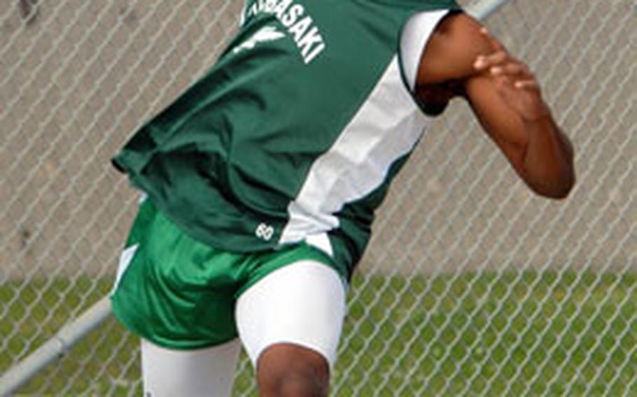 Kubasaki senior Lawrence McClain puts the shot 12.82 meters during Friday&#39;s final regular-season Okinawa Activities Council track and field meet at Mike Petty Stadium, Kubasaki High School, Camp Foster, Okinawa. McClain won the event.