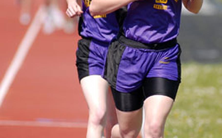 Mannheim&#39;s Susan Grunt, right, leads teammate Rachel Sierkowski and the rest of the pack in the girls 1,500-meters. Grunt won on her home track in 5 minutes, 26.42 seconds, Sierkowski was second.