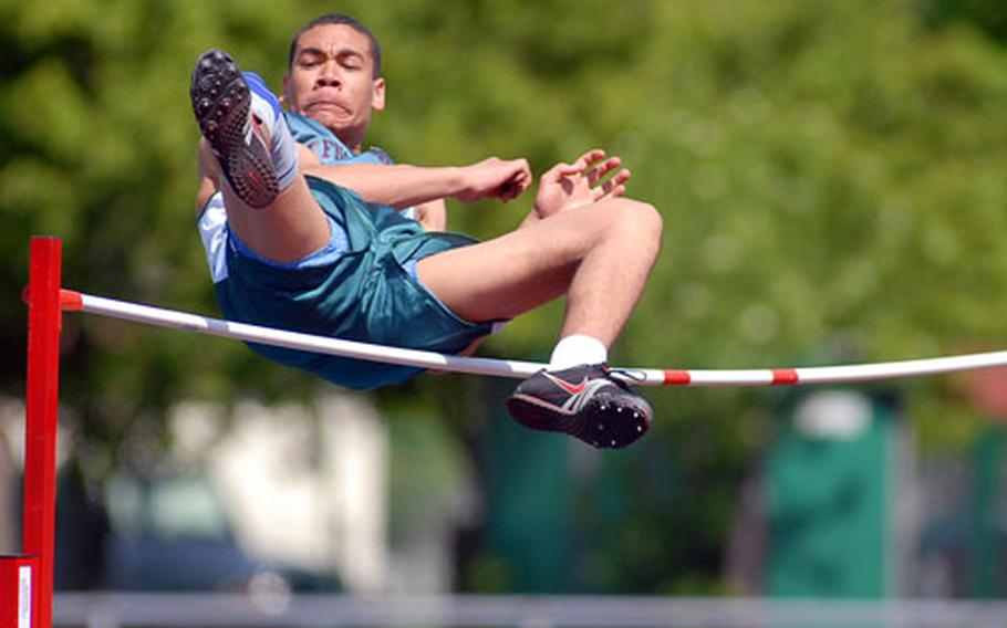 AFNORTH’s Yannick Hickman goes over the bar in the boys high jump. Hickman tied for first with a leap of 5-10.