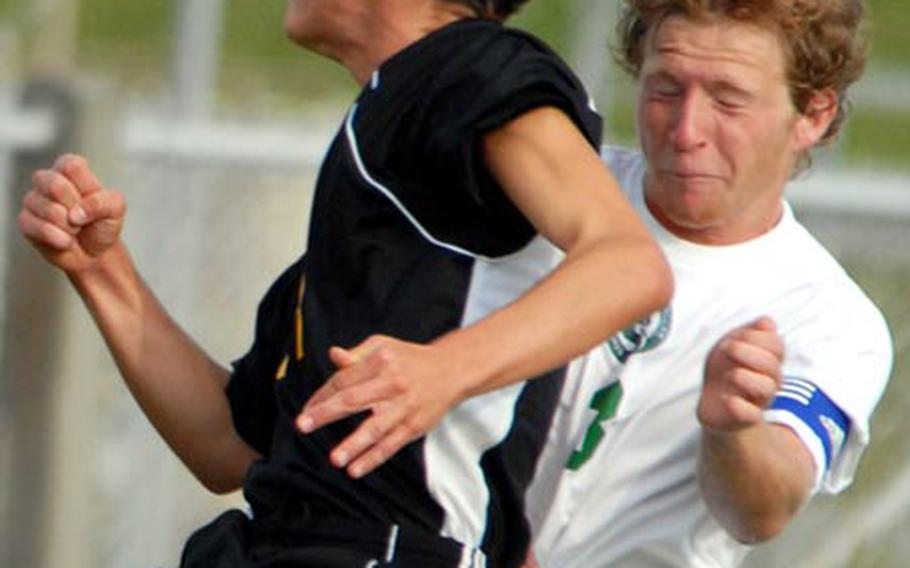 Will Mackey of the Kadena Panthers and Jacob Hess (3) of the Kubasaki Dragons go up to head the ball during Friday&#39;s Okinawa Activities Council boys soccer match at Mike Petty Stadium, Kubasaki High School, Camp Foster, Okinawa. Kadena edged Kubasaki 3-1 and won the five-match season series 3-2.