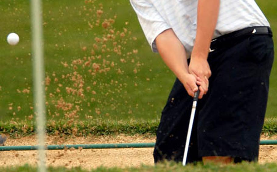 Kadena Panthers sophomore Zachary Lay chips out of a bunker toward the 11th green on Day 2 of the 2008 Okinawa Activities Council district golf championship at the 6,369-yard, par-72 Banyan Tree Golf Course on Kadena Air Base, Okinawa. Lay shot a 17-over-par 89 and finished fourth with a two-day total of 178.
