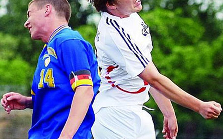 Wiesbaden&#39;s Chris Bryant, left, and Heidelberg&#39;s Gavin Grantham go up for the ball on a corner kick during high school soccer action in Heidelberg on Saturday. Heidelberg won 2-1 to head undefeated into the DODDS-Europe soccer finals starting Wednesday in Ramstein and Kaiserslautern.