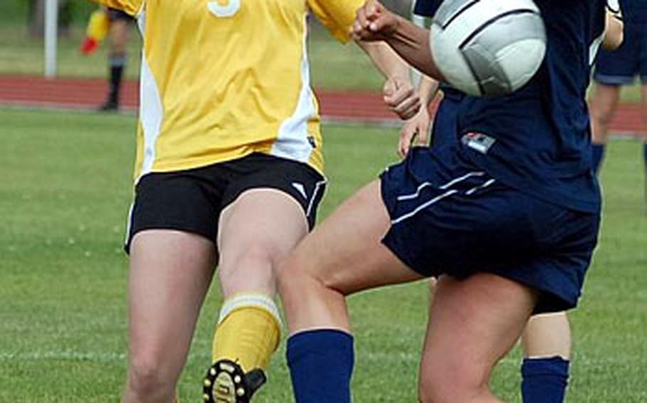 Mannheim&#39;s Brooke Couch, left, gets a shot off despite being pressured by Black Forest Academy&#39;s Bethany Dunn. Mannheim beat BFA 3-0, and heads undefeated to the DODDS-Europe soccer finals.
