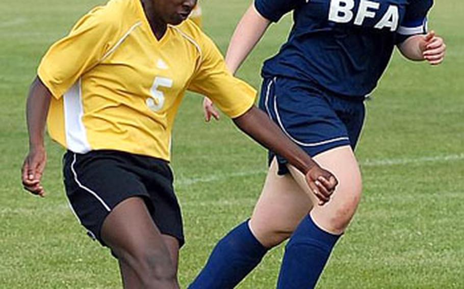 Tayeisha Jackson, left, shoots and scores her second goal of the day during undefeated Mannheim&#39;s 3-0 victory over Black Forest Academy in Mannheim on Saturday.
