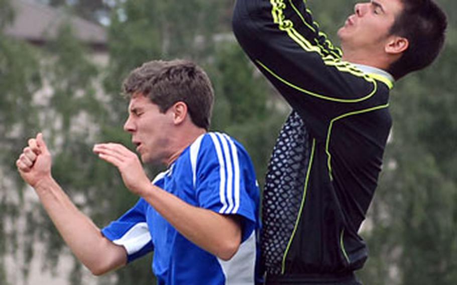 Alconbury goalie David Blose goes higher than Rota&#39;s Alan Dowden in a Division IV semifinal, won by Rota 2-0.
