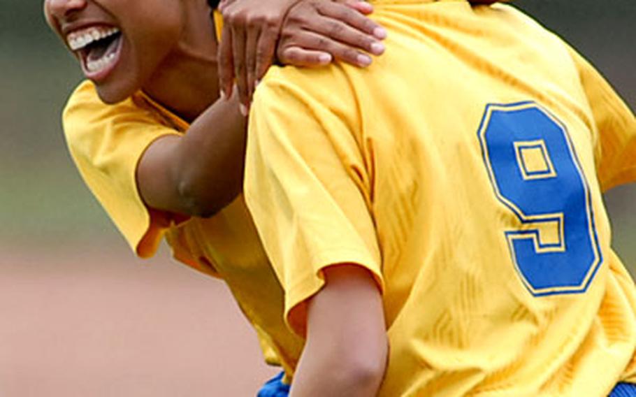 Lajes&#39; Janel Thomas celebrates her goal with teammate Anne Briggs as Lajes beat Alconbury 3-1 on two Thoma goals in the Division IV game.