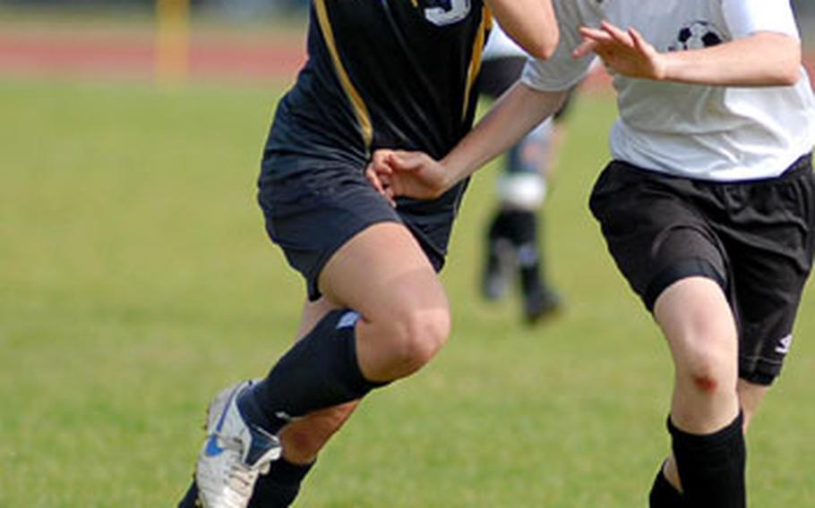 Heidelberg&#39;s Rachel Perotta, left, and Sophie Earl of International School of Brussels chase down a pass in the DODDS-Europe girls Division I soccer final in Ramstein. ISB beat Heidelberg 2-0; Earl scored the second goal.