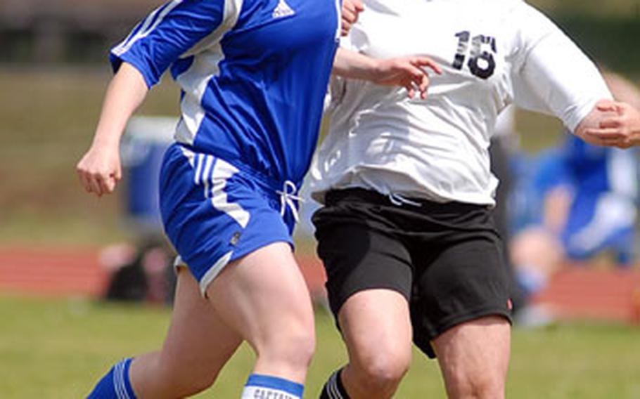 Brussels&#39; Caitlin Quinn, left, and Hanau&#39;s Nastasia Hall fight for a ball in the DODDS-Europe gilrs Division IV soccer final l in Ramstein on Friday. Brussels won 1-0, and Quinn was voted MVP for Division IV.