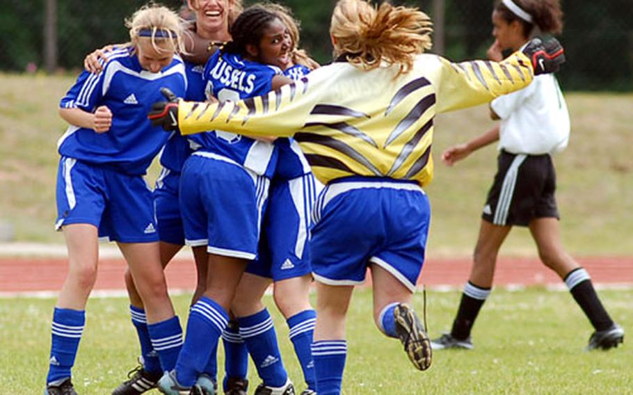 Brussels American School players celebrate their 1-0 win over Hanau.