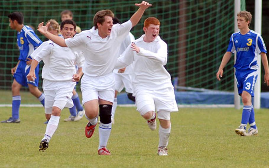 Rota&#39;s Kevin Mallen, center, celebrates his game-winning goal with teammates Jake Andrews, left, and Travis Apling.