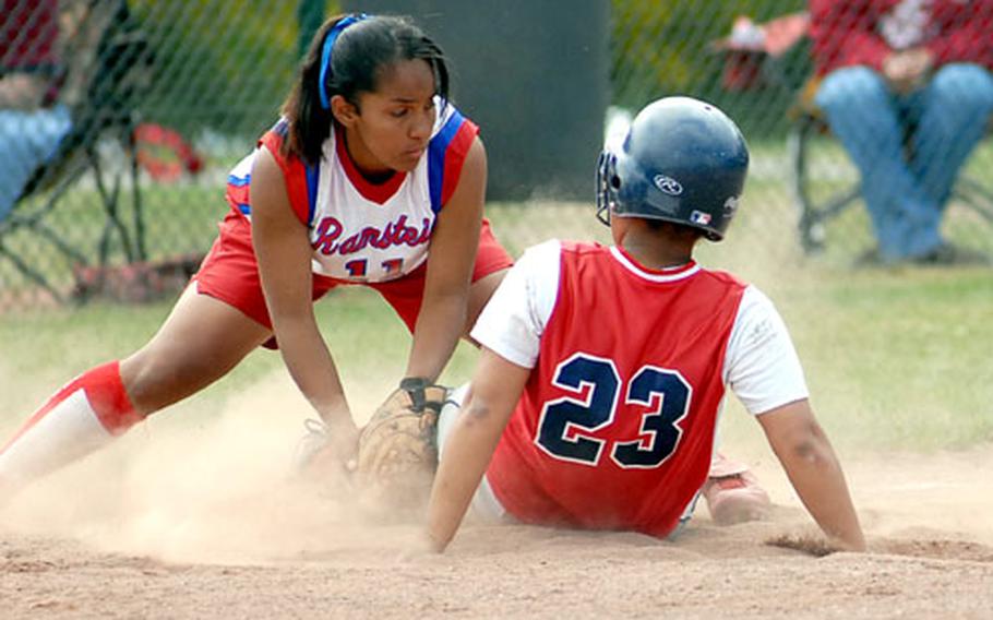 Lakenheath&#39;s Mikel Johnson slides into third under the tag of Ramstein&#39;s Biannca Lopez in the first game of a best-of-three series for the Division I championship. Johnson later scored as Lakenheath won the game 8-4. The series continues Saturday at Ramstein.