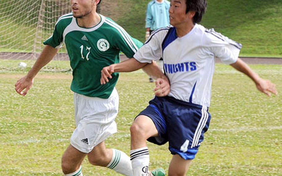 Kubasaki High School&#39;s Bryan Shibley (17) and Christian Academy in Japan&#39;s Lee Isoo race for the ball.
