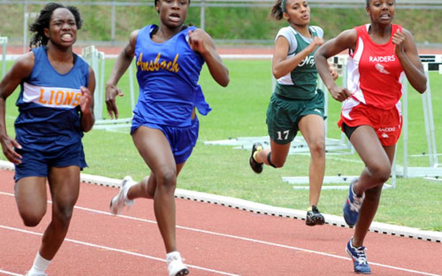 Heidelberg&#39;s Christine Holland, left, overtakes Tiffany Heard of Ansbach, next to her, to win the 200-meter dash at the European track and field championships.