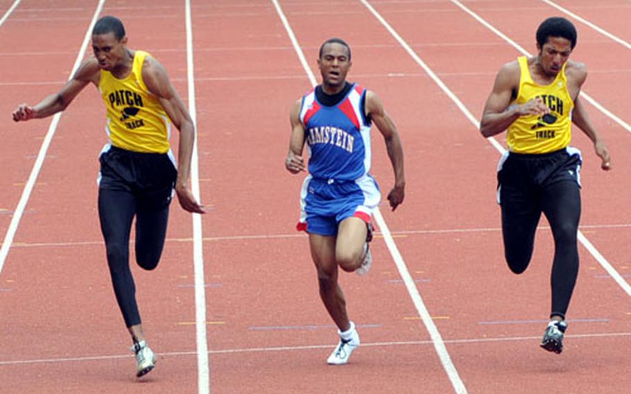 Julius Johnson-Rich, left, of Patch wins the 100-meter dash in 11.46 seconds, ahead of teammate Benji Bowles, right, and Ramstein&#39;s Chris Williams. Johnson-Rich also won the 200- and 400-meter events