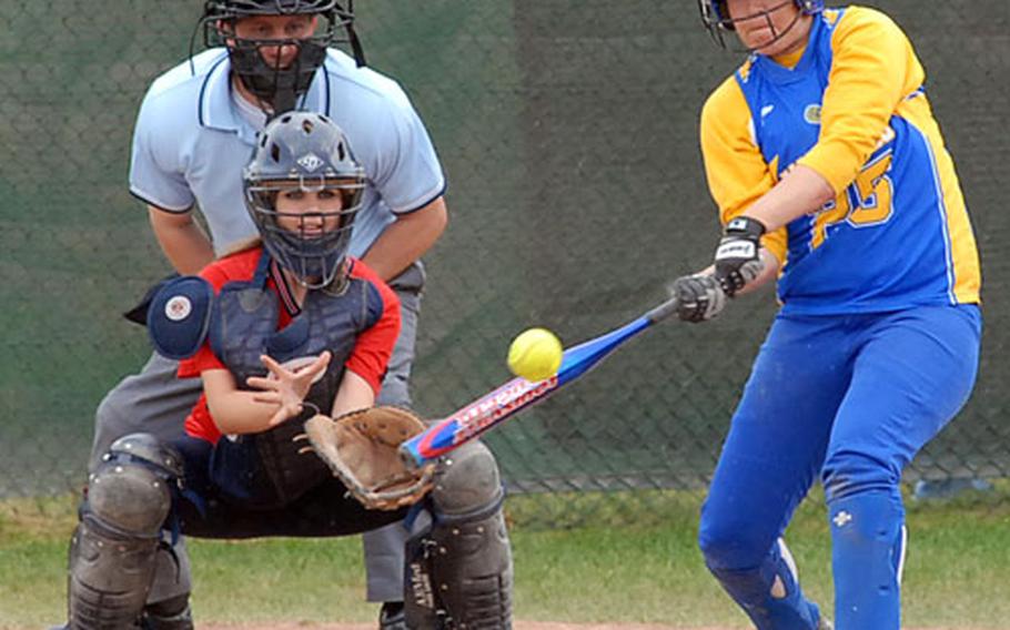 Wiesbaden&#39;s Nancy Jensen connects for a RBI double in the Division II championship game against Bitburg. Wiesbaden won 13-9. Catching for Bitburg is Caitlynn Parks.