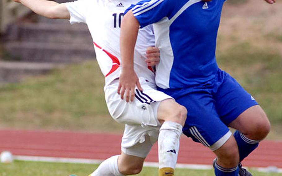 Heidelberg&#39;s Nate Joyner, left, tries to stop Ramstein&#39;s Dan Whitney in second-half action of the boys Division I soccer final at Ramstein Friday night. Heidelberg won the title 3-1 in a shootout.