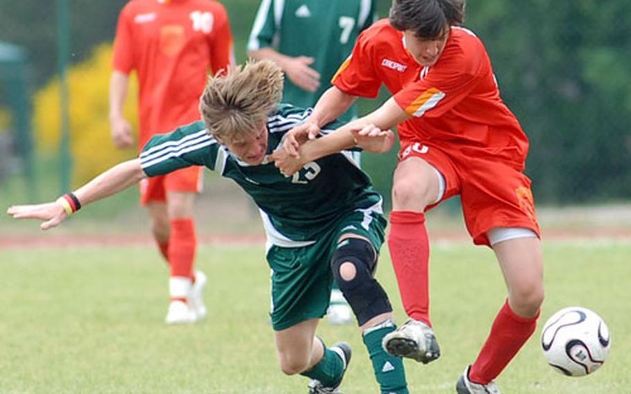 AFNORTH&#39;s Tobias Schick, left, and AOSR&#39;s Eran Efrima fight for the ball in a hard-fought Division III boys final. AFNORTH took the title with a 1-0 win.