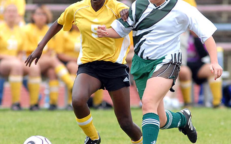 Mannheim&#39;s Tayeisha Jackson, left, and SHAPE&#39;s Megan Campany fight for the ball in the DODDS-Europe girls Division II soccer final, which Mannheim won 2-0.