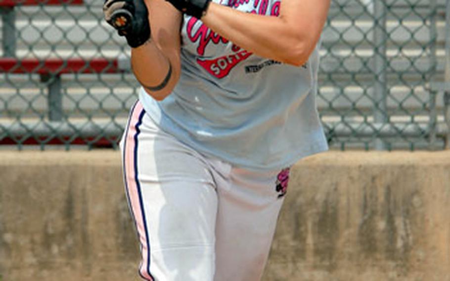 Candace Dugo slaps a base hit to right field against Red Fox of South Korea during Sunday&#39;s double-elimination playoffs. Dugo and the Lady Guzzlers won 14-11. Dugo, assigned to Osan Air Base in South Korea, is three times All-Air Force and twice All-Armed Forces, and is part of a team that holds 23 All-Air Force and 17 All-Armed Forces selections.