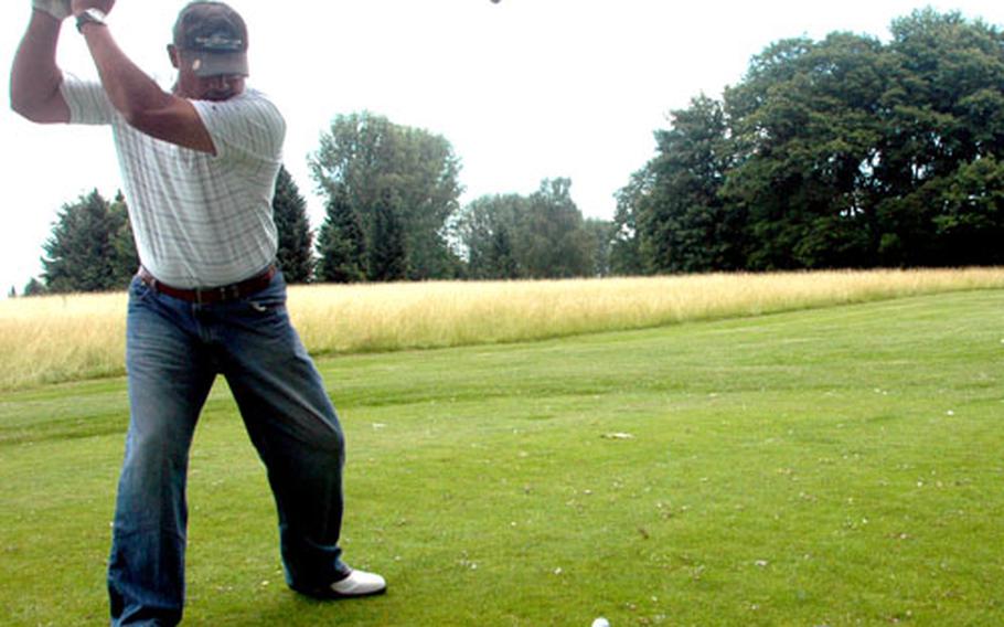 Taatu Lili’u rips a drive from the 15th tee on Friday at the Stuttgart Golf Club, taking care to avoid the tall grass and towering trees along the left side of the fairway. Stuttgart is completing certification as an Audubon Cooperative Sanctuary Program, which requires the course layout to be tailored around the natural habitat.