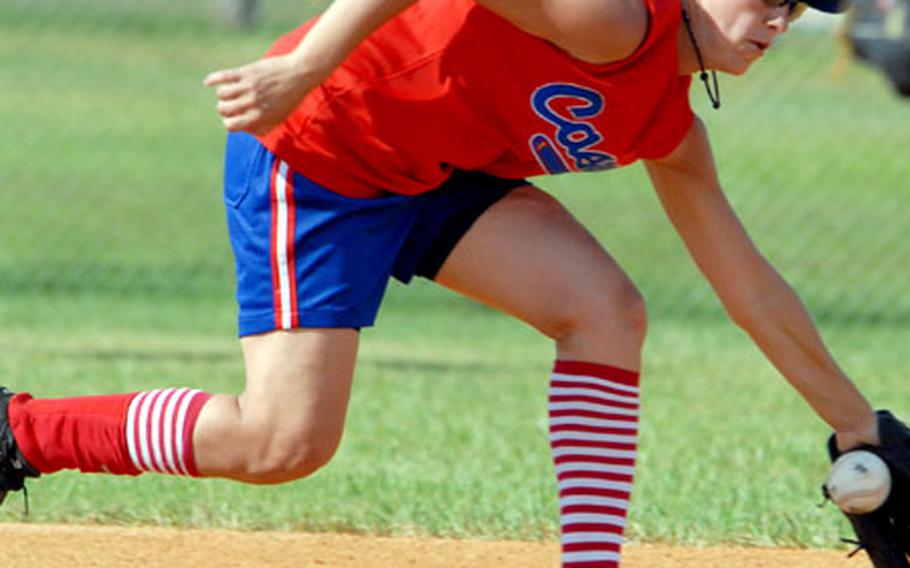 Shortstop Lauren Shaw of South Korea's Area I women's team fields a grounder from Yard Busters of Okinawa during Sunday's championship game. Area I beat Yard Busters 27-16.