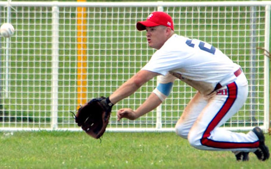 Left fielder David Couch of Osan Air Base, South Korea, dives but can&#39;t quite reach a line drive from American Legion of Okinawa during Sunday&#39;s championship game.