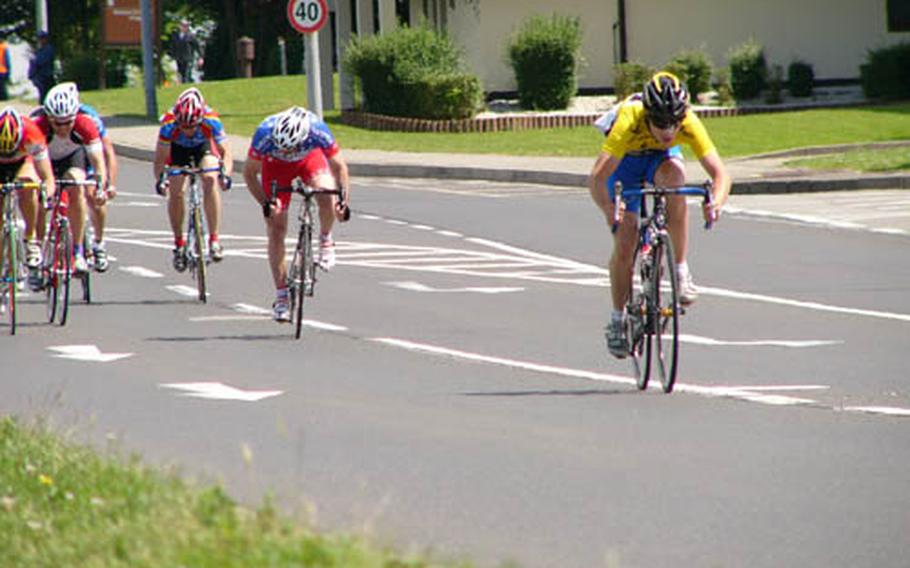 Ramstein’s Carlos Baralt leads the pack which followed Wiesbaden’s Brandon Stone across the finish line of Sunday’s 51.5-kilometer race at Spangdahlem, Germany. From right, the racers and their overall finish positions are Baralt (2); Ramstein’s Merle Richard (3), Hanau’s James Sharp (5), Ramstein’s Trent Hornus (4) and Wiesbaden’s Thomas Essick (3). All five riders were timed in 1hour, 22 minutes, 43 seconds.