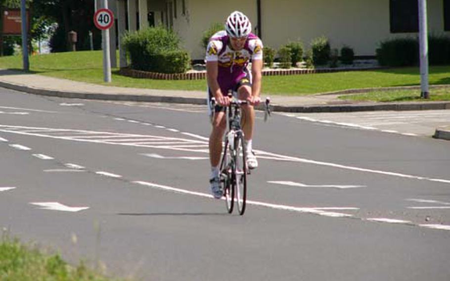 Wiesbaden’s Brandon Stone exceeds the posted speed limit as he’s first across the finish line in Sunday’s 51.5-kilometer U.S. Forces Europe road cycling race in Spangdahlem, Germany. Stone, riding his first race of the season, won in 1 hour, 22 minutes, 30 seconds.