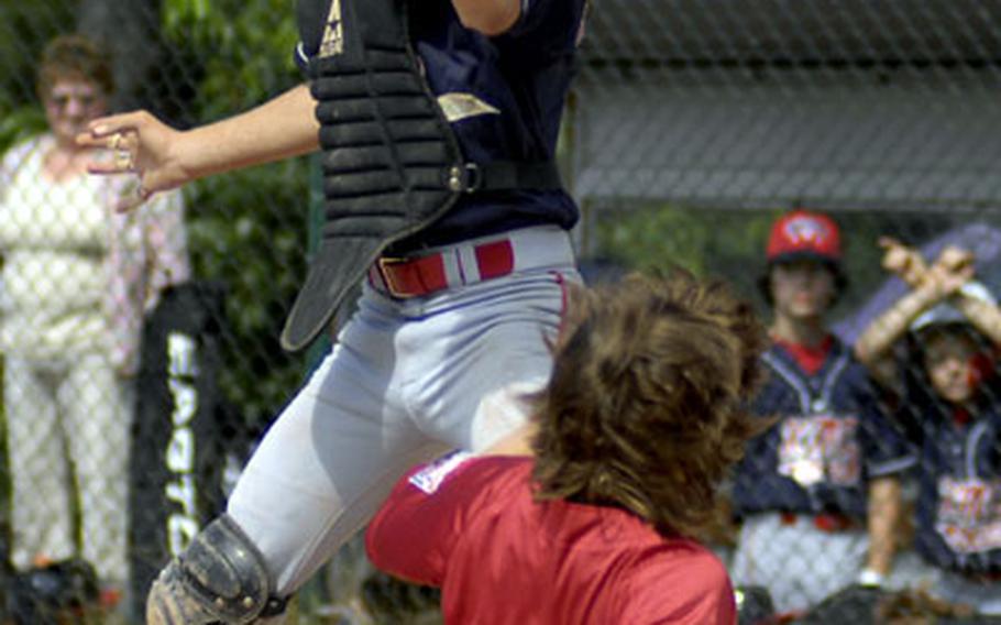 Dust flies as Joseph Sampson of Kaiserslautern tags out David Schmich of Baden Württemberg.