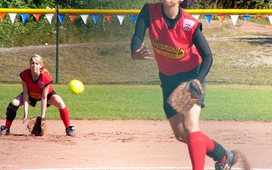 Winning pitcher Maddie Byrd delivers a pitch Wednesday at Ramstein Air Base, Germany, during the Kaiserslautern Military Community&#39;s 7-3 verdict over Poland. At shortstop is fellow All-European and Ramstein High teammate Lindsey Jones, who relieved Byrd briefly in the championship game.