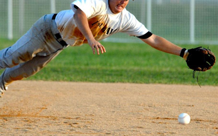 Shortstop Tim Dawsey of 1st Marine Aircraft Wing dives for a Marine Corps Base Camp S.D. Butler ground ball during Thursday&#39;s knockout game. Wing dethroned defending champion Base 14-9, and moved on to play 3rd Marine Division/III Marine Expeditionary Force in the double-elimination championship game.