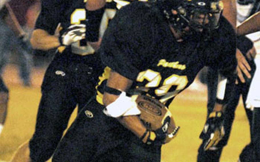 Kadena linebacker Vince Coronado (39) takes off for the end zone with a recovered fumble during Friday's Okinawa Activities Council football season-opening game. Coronado returned the fumble 58 yards for a touchdown for the Panthers, who forced six turnovers in a 13-0 shutout.