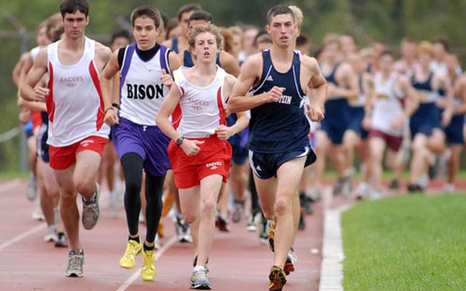 Eventual winner Kel Secrest, center, leads the pack at the start of the boys&#39; cross country race in Wiesbaden on Saturday. More than 100 runners from six schools took part in the race.