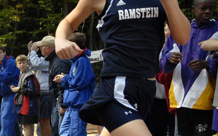 Ramstein senior Kelsey Collier crosses the finish line in second place in the girls cross country meet at Vogelweh, near Kaiserslautern, Germany, on Saturday. Mannheim eighth-grader Daniell LaFleur won the race but was competing in an exhibition status.