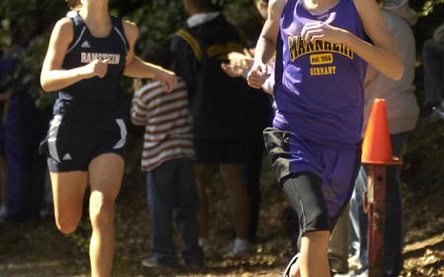 Daniell LaFleur, an eigth-grader from Mannheim Middle School, pulls away from Kelsey Collier of Ramstein for a solid victory in the girls cross-country meet in Vogelweh, near Kaiserslautern, on Saturday. LaFleur&#39;s win did not count because she was competing in an exhibition status.