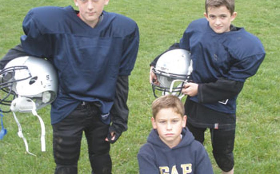 From left: Cody Van Zant, 12, Lucas Markos, 10, and Nathan Van Zant, 10, can play football this season after the Installation Management Command-Europe granted U.S. Army Garrison Grafenwöhr a policy exception allowing underweight children to join teams.
