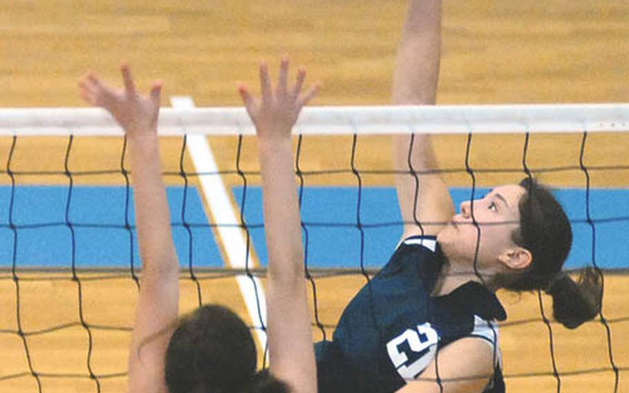 Vilseck&#39;s Angel Swann, left, tries to block a return by Lakenheith&#39;s Jessica Serd in an opening-day, Division I match at the DODDS-Europe volleyball championships in Kaiserslautern on Thursday. Lakenheath won 22-25, 25-12, 15-11.