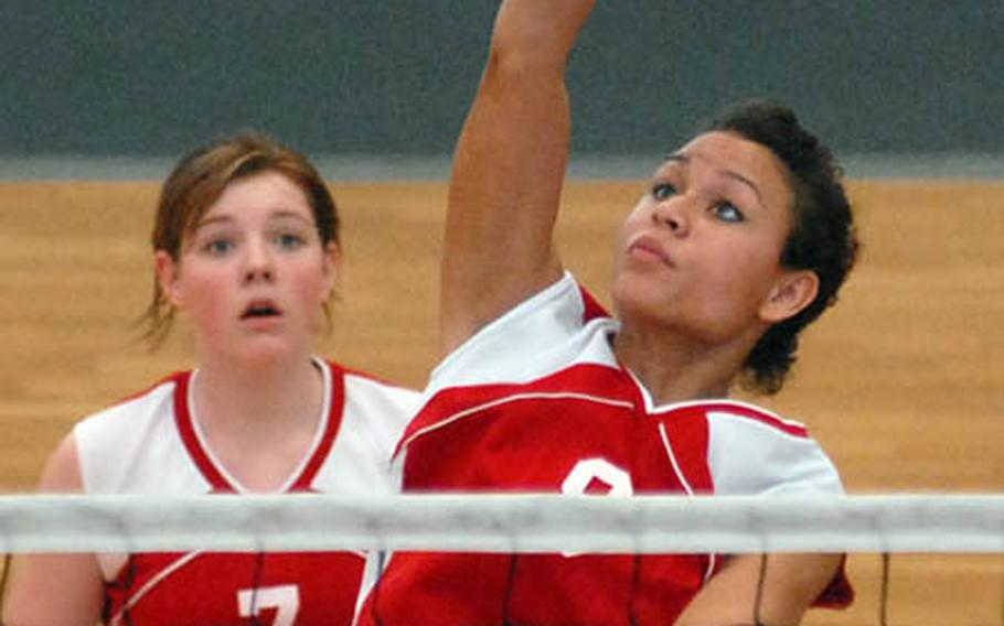 Kaiserslautern&#39;s Shamona Cunningham spikes against Lakenheath, as teammate Karah Helm watches, on opening day of the DODDS-Europe volleyball finals. Kaiserslautern lost an exciting match 25-17,19-25, 13-15.