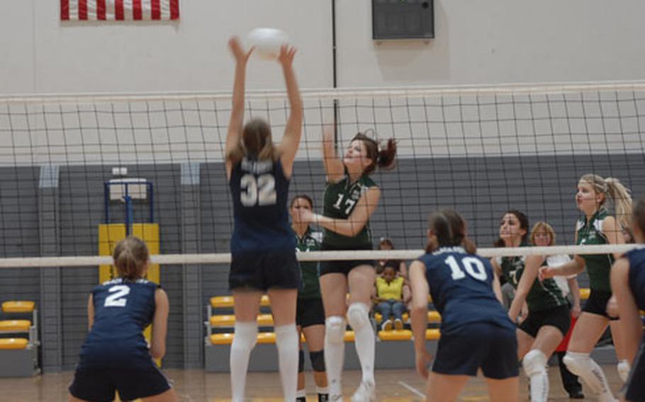 SHAPE sohpomore Liene Basuka spikes the ball in the DODDS-Europe girls volleyball championship Division II match against Black Forest Academy Saturday at Ramstein as Joanna Kelley (32) tries for a block. SHAPE lost in five sets. It was the second straight year they lost in the final match. Kelley was the D-II MVP.