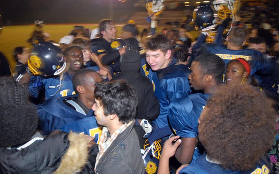 The Heidelberg Lions celebrate after capturing the Division I crown by beating Ramstein 9-6 on Saturday night.