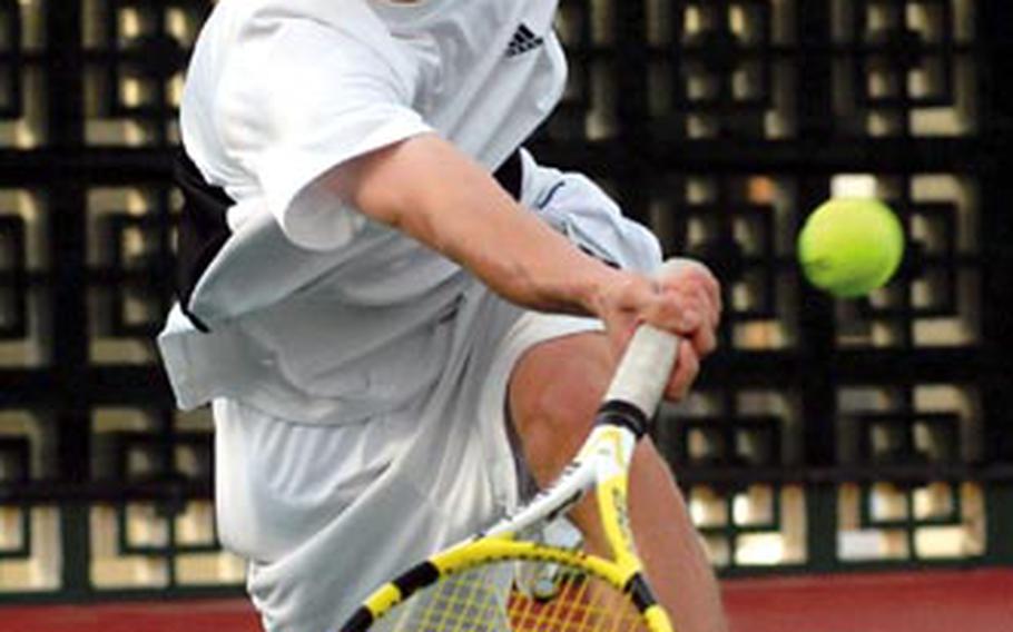 Kadena Panthers junior Kyle Sprow races forward for a shot during Wednesday&#39;s boys doubles championship match in the 2008 DODDS-Pacific Far East High School Tennis Tournament at Risner Tennis Complex, Kadena Air Base, Okinawa. Sprow teamed with Eliott Mason to beat Jay Pothula and John Bogen 6-0, 6-3 and redeem themselves for their boys doubles championship loss a year ago.