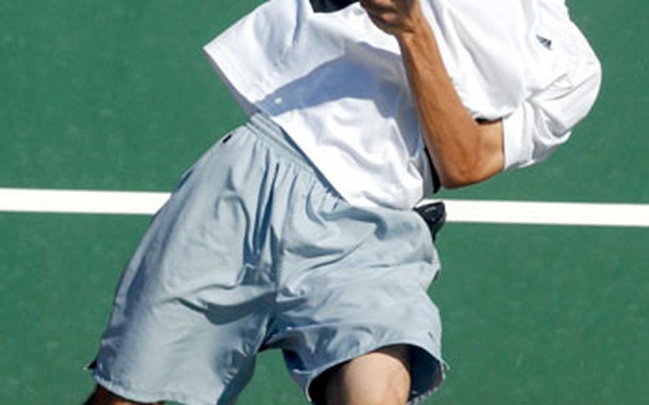 Kadena junior Eliott Mason serves it up against Kadena Kyle Sprow during Thursday&#39;s boys singles championship match.