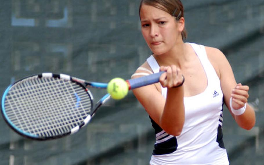 Kadena junior Elissa Mason slaps a forehand return to Seoul American junior Kennedy Allen during Thursday&#39;s girls singles championship. Mason dethroned defending champion Allen 6-4, 6-2 for her first Far East singles title.