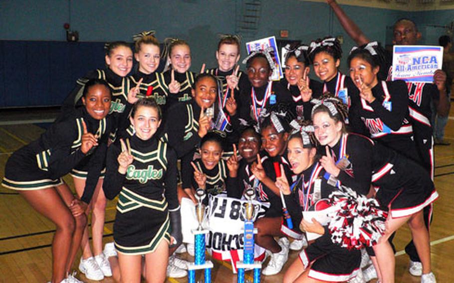 Members of the Robert D. Edgren Eagles and Nile C. Kinnick Red Devils cheerleading teams pose together after both captured consecutive Far East cheerleading championships. The Eagles won their second straight class A crown. The Red Devils won their third class AA in a row.