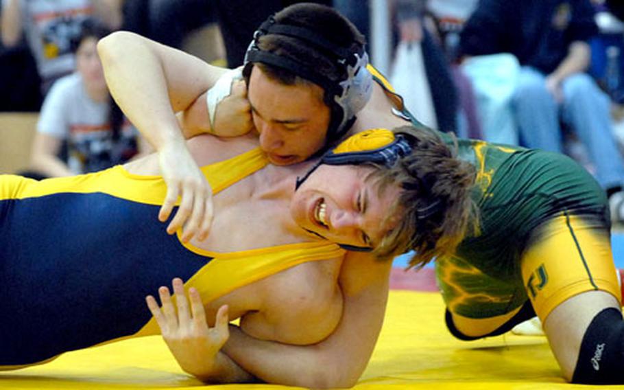 Matt Lyon, top, of St. John’s of Brussels, struggles to control Wiesbaden’s Michael Spencer in the 145-pound final at the DODDS-Europe wrestling championships in Wiesbaden, Germany, in February. Lyon won the match to finish the season undefeated.