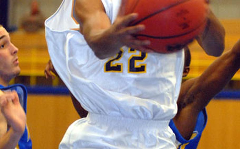 Heidelberg’s Chris Frazier splits Wiesbaden defenders in the opening game of the season on Tuesday. The All-Europe first-team senior guard is back as the Lions try for a three-peat this season.