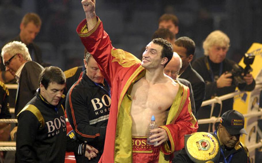 Wladimir Klitschko reacts to cheering fans after beating Hasim Rahman in the IBF, WBO, IBO heavyweight world championship fight at SAP Arena in Mannheim Saturday.