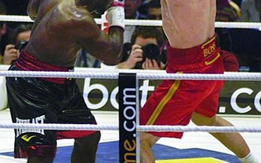 Wladimir Klitschko jabs at Hasim Rahman during the fourthth round in their heavyweight world championship fight at SAP Arena in Mannheim Saturday. Klitschko won by TKO in the seventh round.