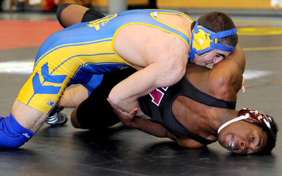 Vilseck&#39;s T.J. Blunt, right, feels the pressure from Ansbach&#39;s Dominic Barrale during a 171-pound match in Heidelberg on Saturday, as DODDS-Europe sports resumed after the Christmas holiday break. Barrale won the match on a fall.